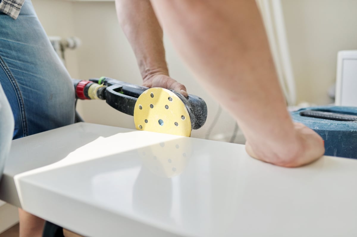Specialist grinding and restoring a stone surface with professional equipment